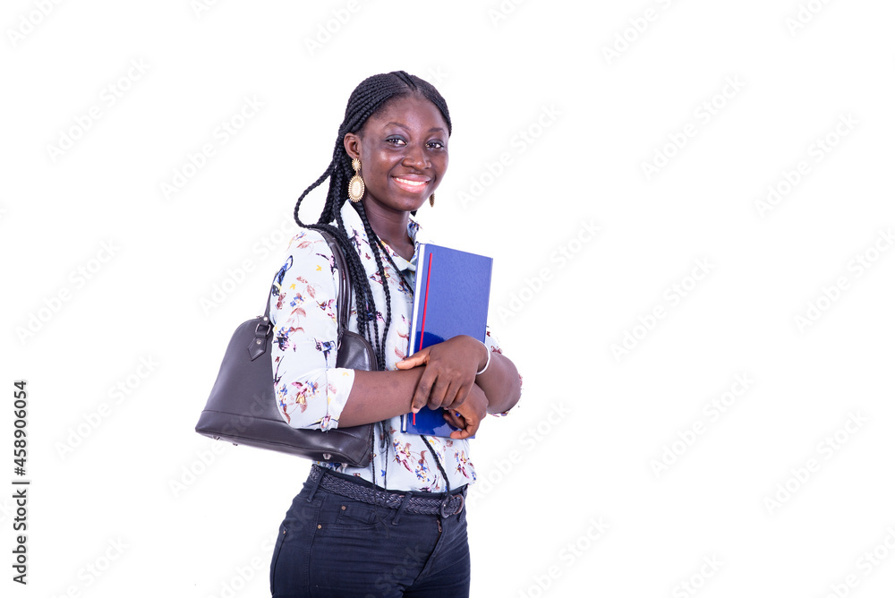 beautiful young happy student woman embracing her notebook smiling. beautiful young happy student woman embracing her notebook smiling.