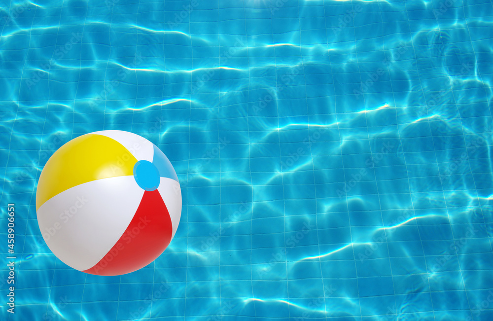 Beach ball in swimming pool Stock Photo | Adobe Stock