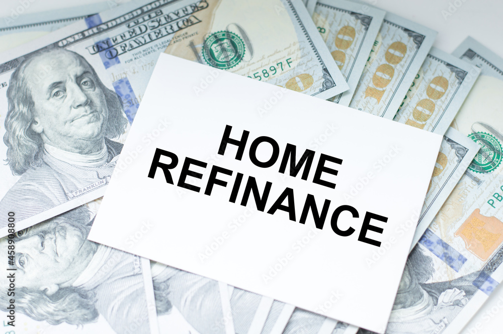 business card with HOME REFINANCE text on the background of money on the table business card with HOME REFINANCE text on the background of money on the table