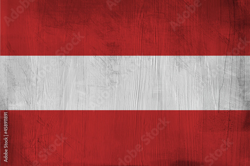 Patriotic wooden background in color of Austria flag 