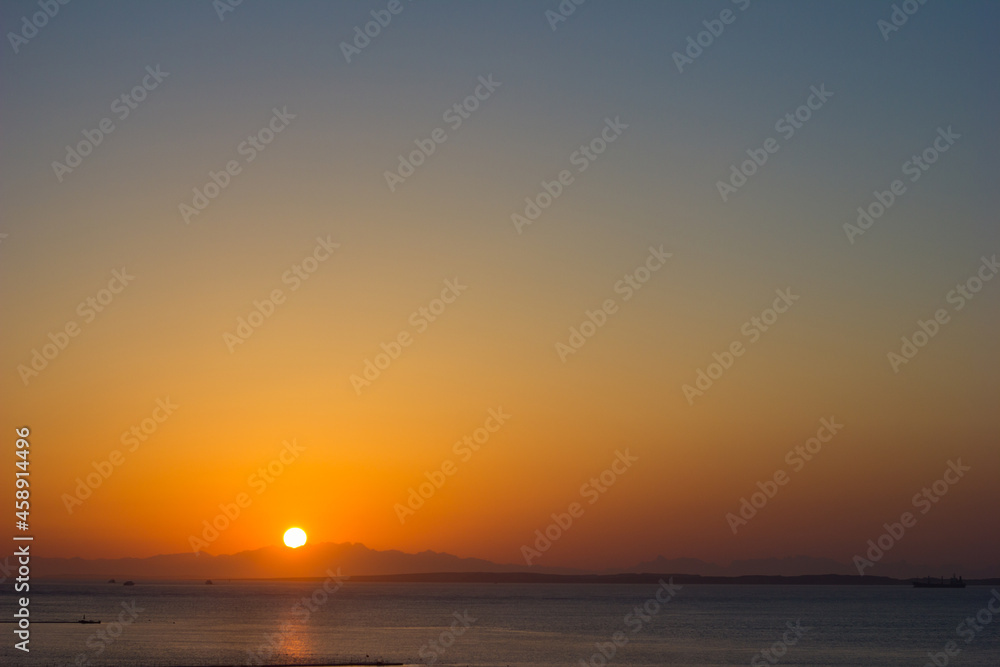 Dawn sunset over the sea or ocean, beautiful seascape at dusk, selective focus	
