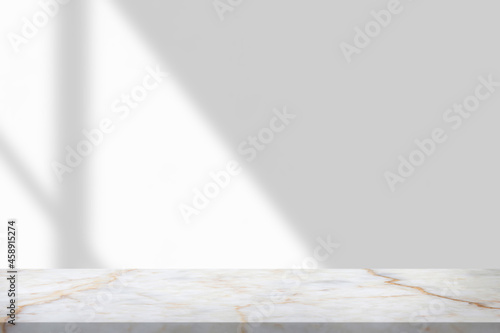 Marble table with window shadow drop on white wall background for mockup product display