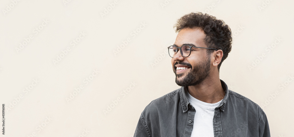 © kite_rin - Closeup portrait of handsome smiling young man. Laughing joyful cheerful men isolated studio shot. Panoramic banner