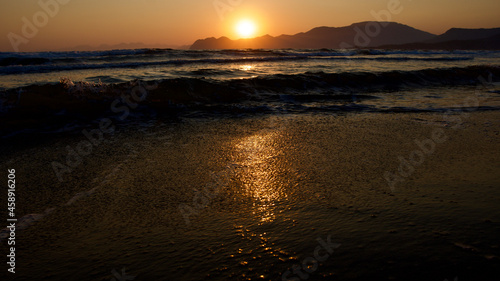 Spawning place of Caretta Caretta turtles  Iztuzu beach. Golden sun rays reflecting off the sea at sunset. Spectacular sunset at the meeting point of the Mediterranean and Aegean.