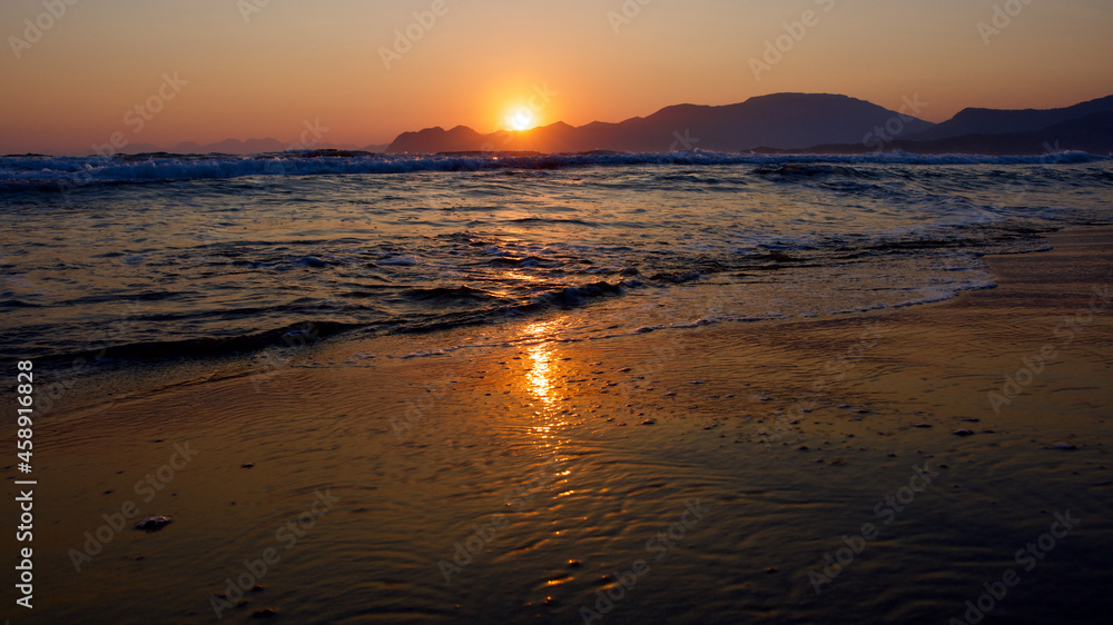 Spawning place of Caretta Caretta turtles: Iztuzu beach. Golden sun rays reflecting off the sea at sunset. Spectacular sunset at the meeting point of the Mediterranean and Aegean.