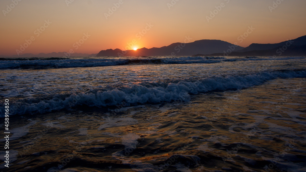 Spawning place of Caretta Caretta turtles: Iztuzu beach. Golden sun rays reflecting off the sea at sunset. Spectacular sunset at the meeting point of the Mediterranean and Aegean.