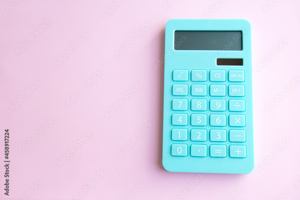 Mint calculator isolated on pink background with copy space. Concept of family budget, investments Mint calculator isolated on pink background with copy space. Concept of family budget, investments