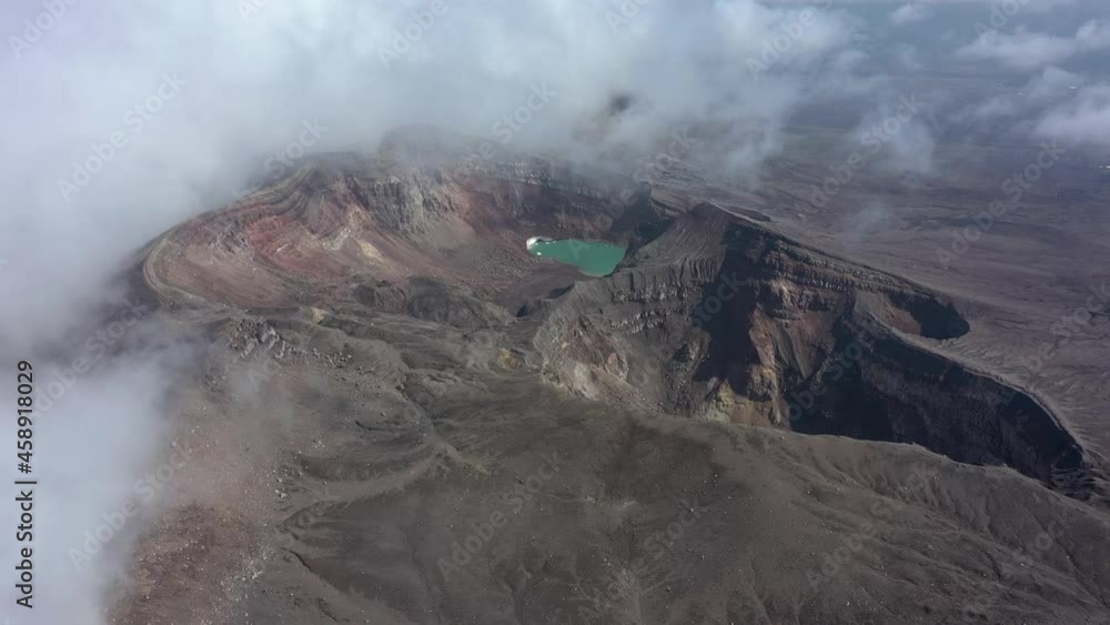 custom made wallpaper toronto digitalCrater with active volcano Goreliy smoke and clouds. Kamchatlka peninsula. Camera moving forward. 4K video. Aerial footage.
