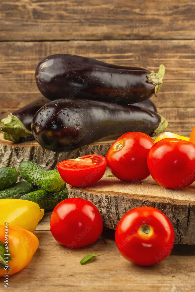 Assortment of fresh vegetables on a wooden background