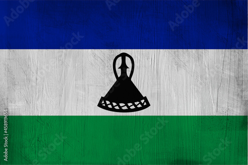 Patriotic wooden background in color of Lesotho flag