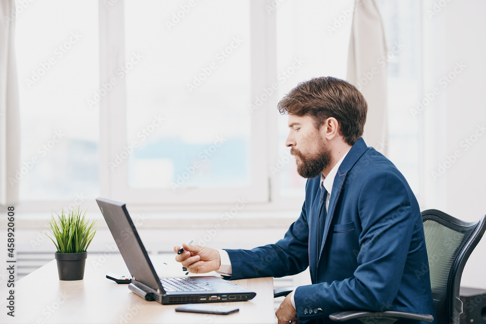 businessmen in the office in front of a laptop executive success businessmen in the office in front of a laptop executive success