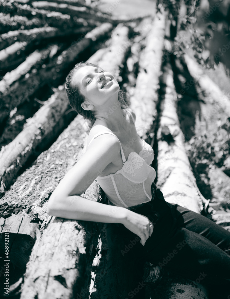 a girl in a beautiful lingerie corset in the forest, magazine photo a girl in a beautiful lingerie corset in the forest, magazine photo