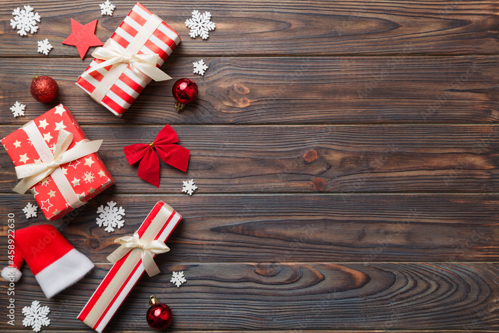Obraz premium New Year composition. Christmas decor background with gift boxes. Top view with copy space