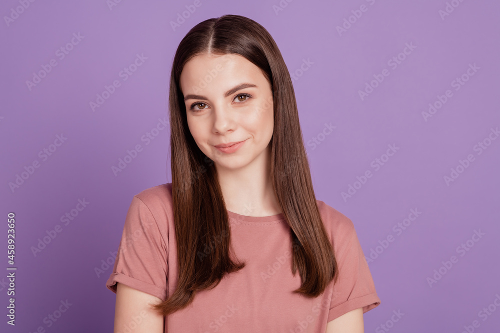 Photo of young sweet smiling girl isolated on purple background Photo of young sweet smiling girl isolated on purple background