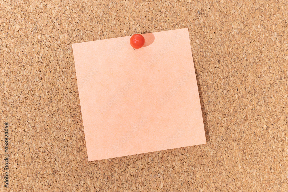 Blank note and push pin on cork board. Template to ad text or drawings Blank note and push pin on cork board. Template to ad text or drawings