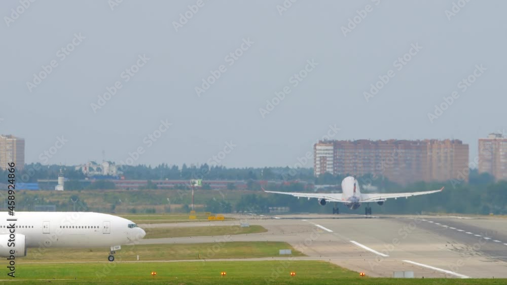 Airplane driving along the taxiway Airplane driving along the taxiway