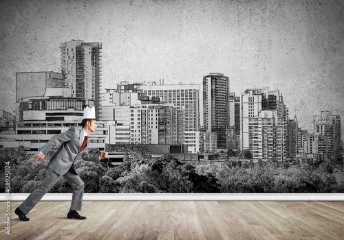 King businessman in elegant suit running and drawn cityscape silhouette at background