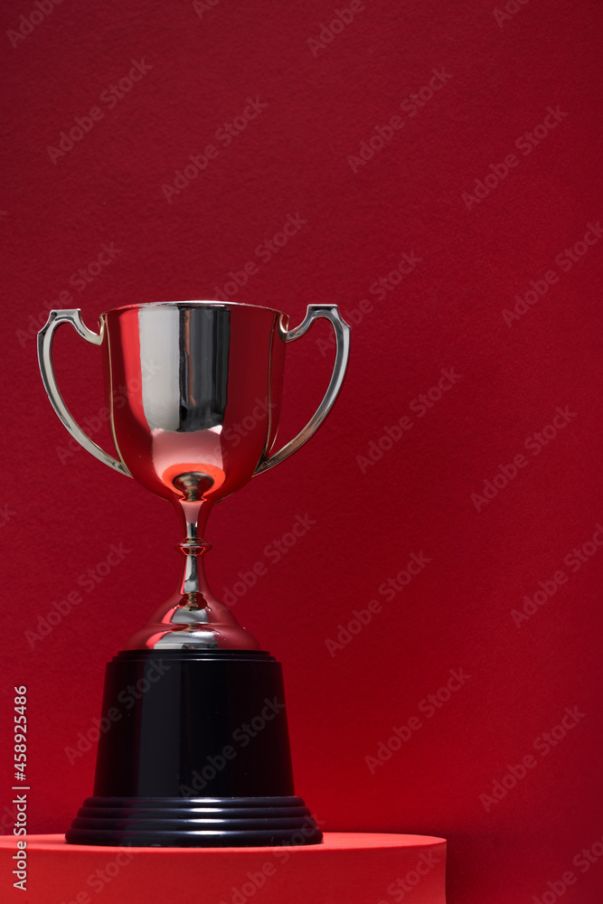 Fototapeta premium Close up classic trophy on the red background