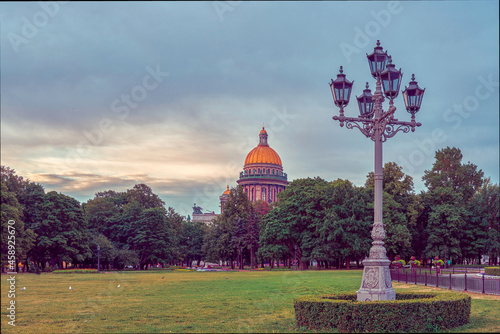 Morning city landscape of St. Petersburg, view of the city park in the background is visible the dome of St. Isaac's Cathedral. photo