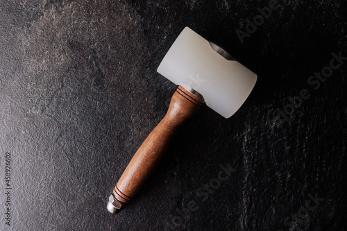 a tool for working with leather, a leather hammer