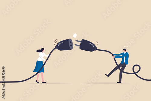 Disconnected business, broken communication, 404 or disconnect from social media distraction or monitor screen, young man and young adult woman pull electric socket plug to disconnect from internet.