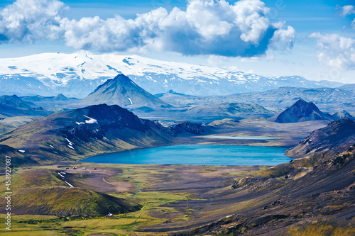 Beautiful Icelandic landscape with mountains, lake, sky and clouds. Trekking in national park Landmannalaugar