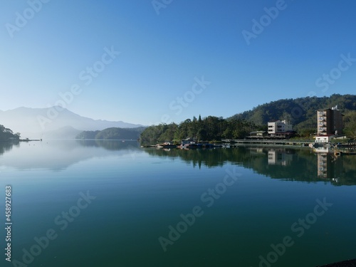 A perfect morning reflection of a calm Sun Moon Lake,  Taiwan © Kittas