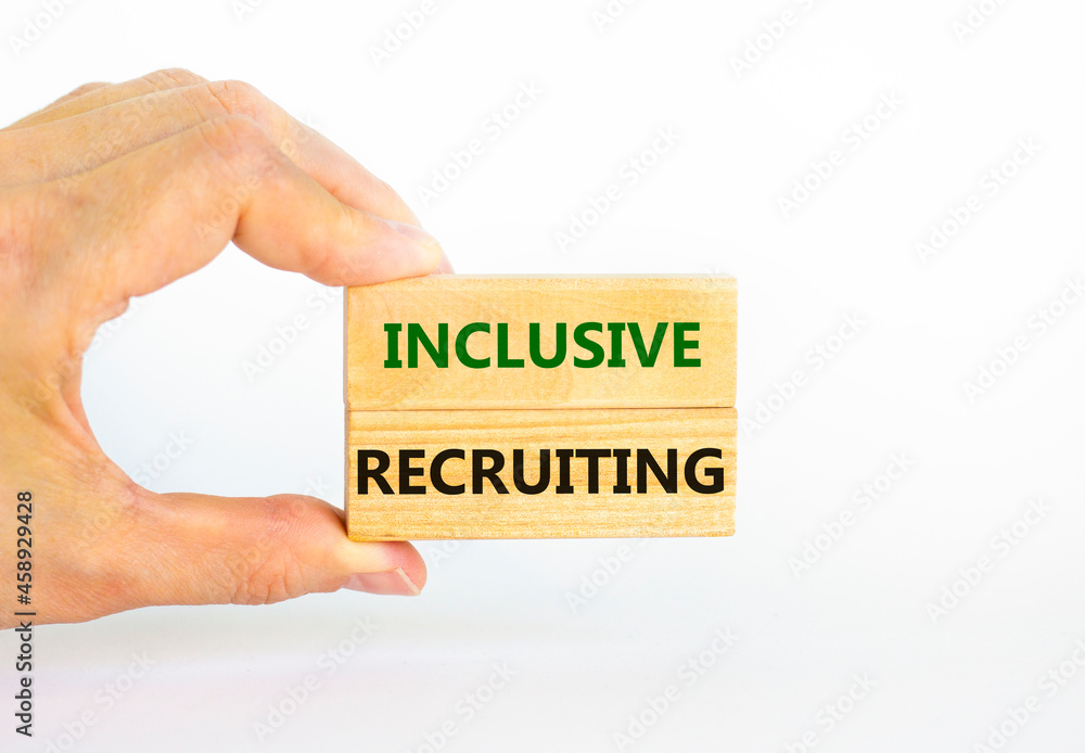 Inclusive recruiting symbol. Wooden blocks with words Inclusive recruiting on beautiful white background. Businessman hand. Business, HR and inclusive recruiting concept. Copy space. Inclusive recruiting symbol. Wooden blocks with words Inclusive recruiting on beautiful white background. Businessman hand. Business, HR and inclusive recruiting concept. Copy space.