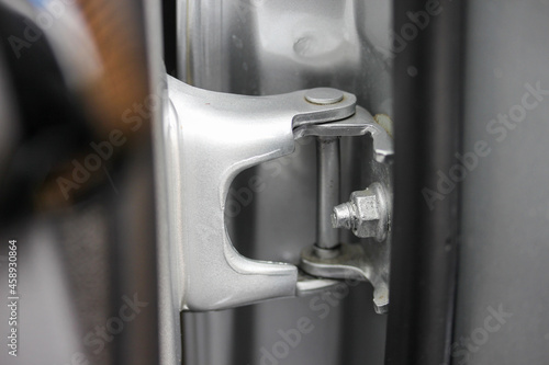 Close up of a car door hinge photo