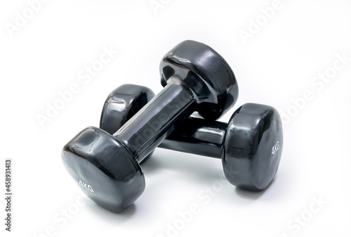 Dumbbell pair set. Fitness weight equipment. Gym and body building black weights exercise. Isolated over white background with clipping path