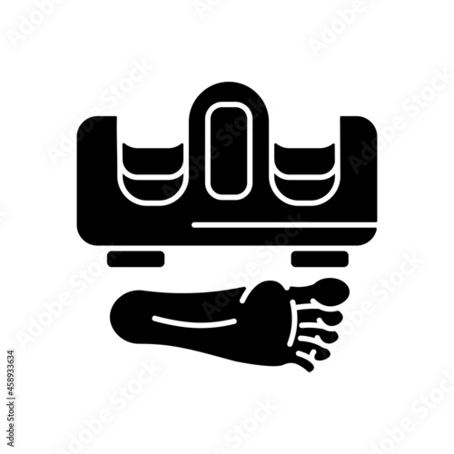 Foot massager black glyph icon. Electric device for feet stimulation. Foot massage machine. Beauty procedure and treatment. Body care. Silhouette symbol on white space. Vector isolated illustration