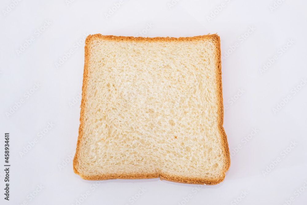 one white slice of bread on a white plate.