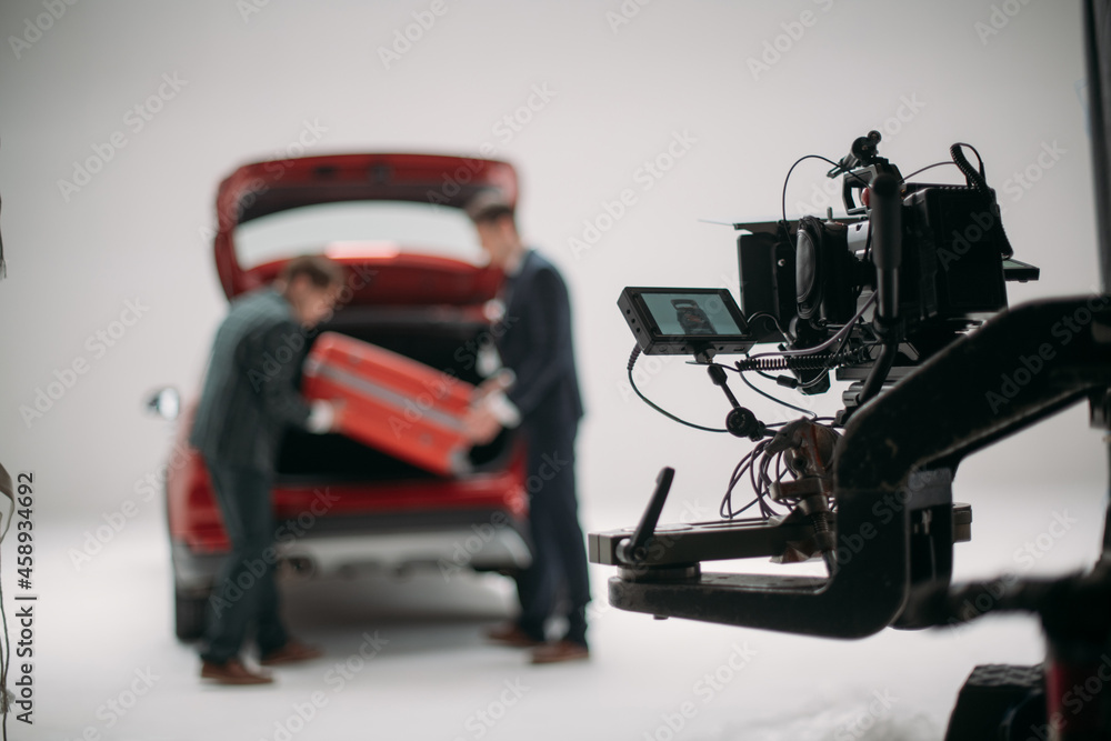 Professional cinema and video camera on the set. Shooting shift, lighting fixtures, shooting equipment and the team. Professional cinema and video camera on the set. Shooting shift, lighting fixtures, shooting equipment and the team.