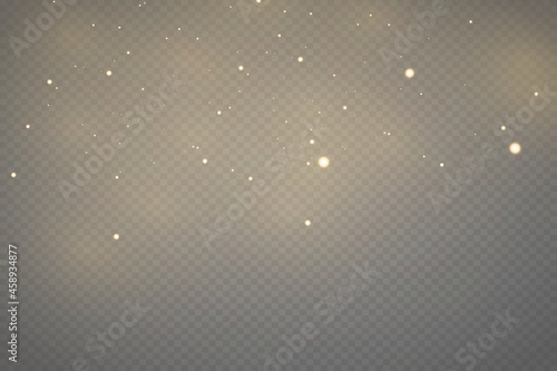Christmas falling golden lights. Magic abstract gold dust and glare. Festive Christmas background.