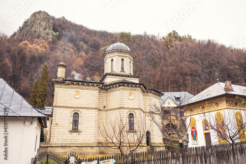 Stanisoara monastery called Nucet, situated at the foot of massive tails, Calimanesti town, Valcea county. Olt Valley bridge beautiful gorge river in Romania, defile carved valley Cozia national park photo