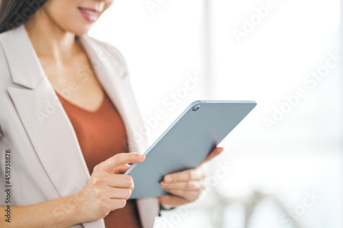 Businesswoman Using Digital Tablet Computer and Working Outdoors Office