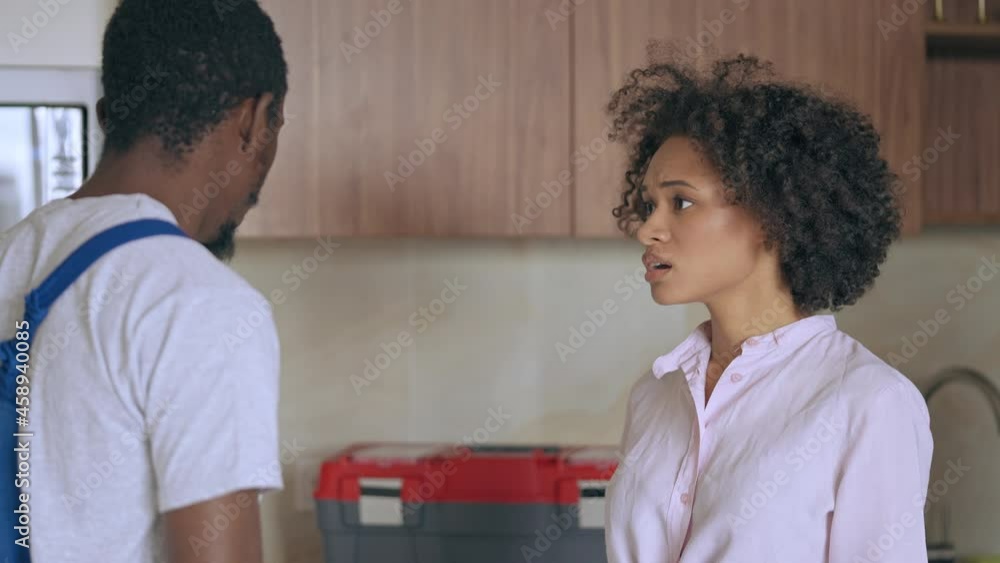 Upset tenant talking to property manager about home maintenance problem, repair Upset tenant talking to property manager about home maintenance problem, repair