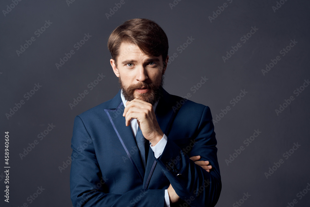 The man in a suit executive office dark background The man in a suit executive office dark background