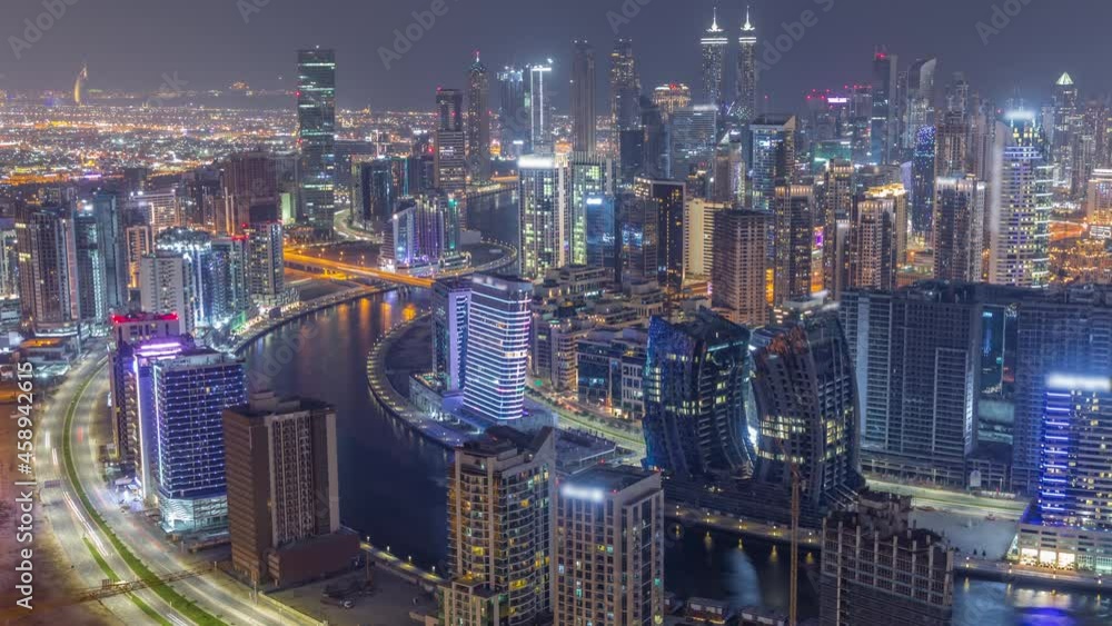 Skyline with modern architecture of Dubai business bay towers night timelapse. Aerial view Skyline with modern architecture of Dubai business bay towers night timelapse. Aerial view
