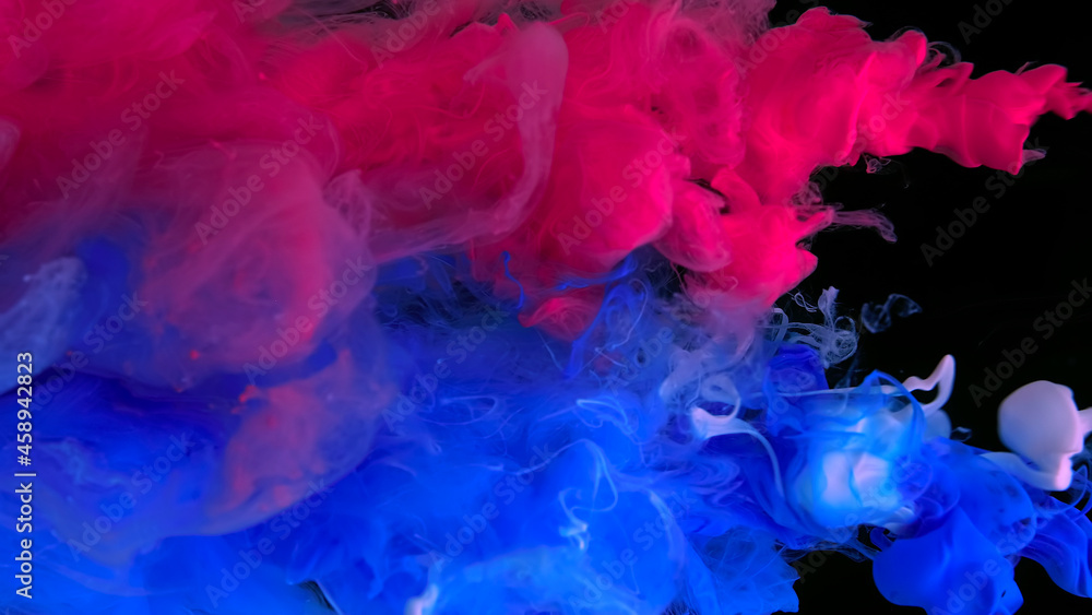 Scarlet, white and blue watercolor paints in water on a black background. Awesome abstract background. Beautiful wallpaper for your desktop. Colored cloud of ink on a black background. Scarlet, white and blue watercolor paints in water on a black background. Awesome abstract background. Beautiful wallpaper for your desktop. Colored cloud of ink on a black background.
