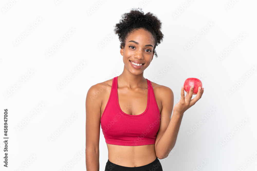 Young African American woman isolated on white background with an apple
