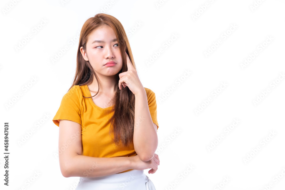 Young beautiful Asian woman pointed a finger to her head and smiled isolated on white background ,She shows that she is coming up with new plans to get her work done Young beautiful Asian woman pointed a finger to her head and smiled isolated on white background ,She shows that she is coming up with new plans to get her work done