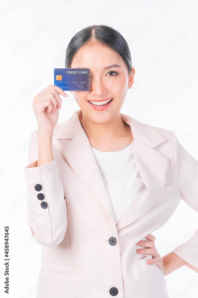 Business Asian woman showing credit card for payment shopping online , paying by credit card online shopping e-commerce telemarketing concept Business Asian woman showing credit card for payment shopping online , paying by credit card online shopping e-commerce telemarketing concept