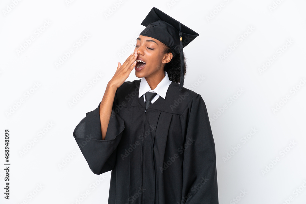 Young university graduate African American woman isolated on white background yawning and covering wide open mouth with hand Young university graduate African American woman isolated on white background yawning and covering wide open mouth with hand