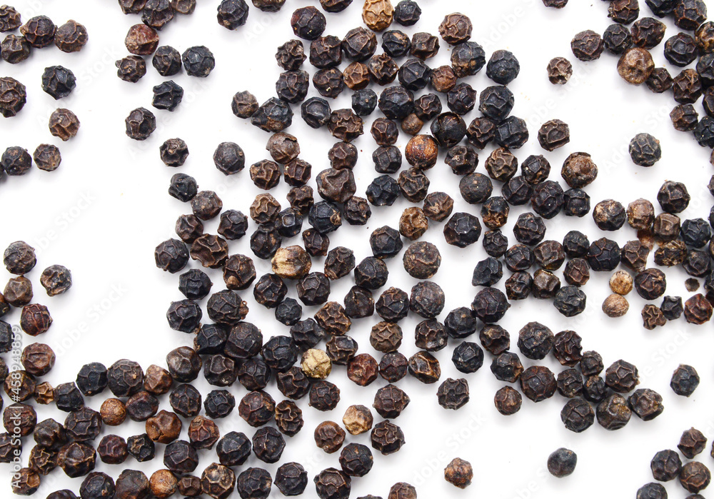 Red and black peppercorns, isolated on white background Red and black peppercorns, isolated on white background