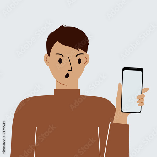 Angry man with mobile phone, front view. Taking pictures, reading, chatting. Smartphone and internet addiction.