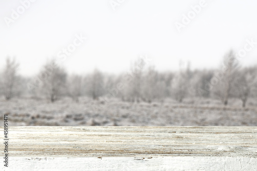 Wallpaper Mural Wooden desk of free space for your decoration and winter landscape of mountains.  Torontodigital.ca