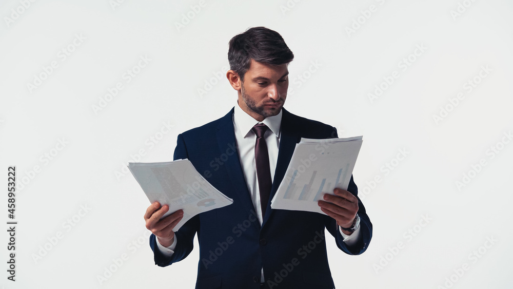 Manager in formal wear looking at papers isolated on white Manager in formal wear looking at papers isolated on white