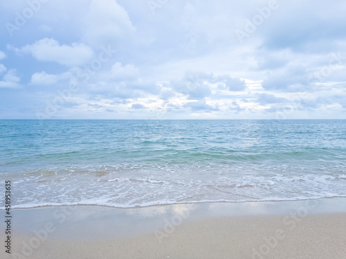 Sand beach and blue sea and blue sky