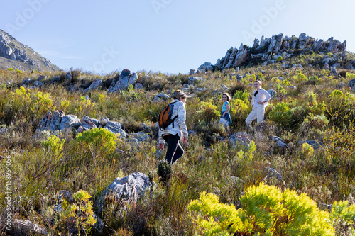 Family hiking a nature trail, Phillipskop nature reserve, Stanford, South Africa. photo